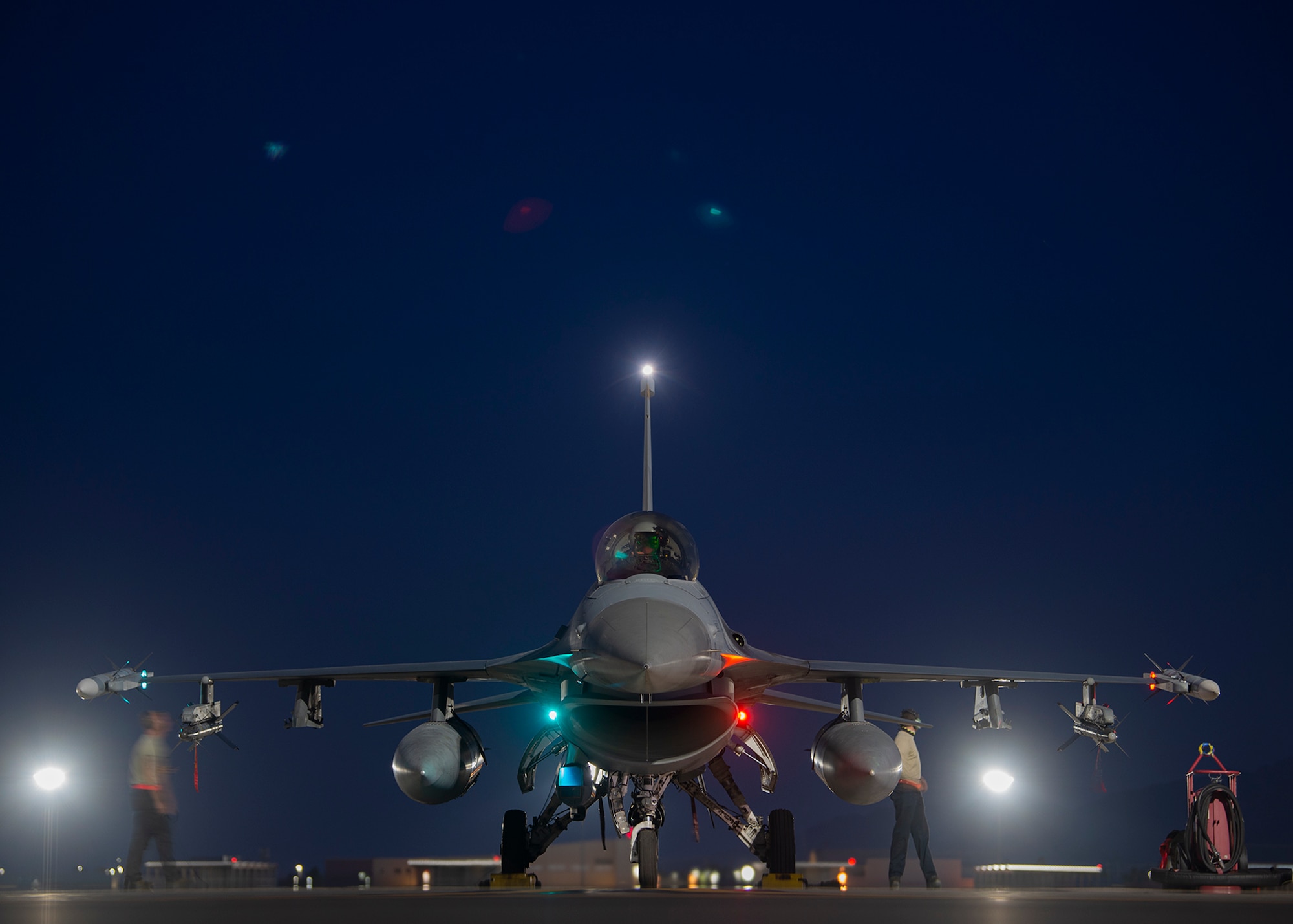 Airmen prepare an aircraft for take-off on the flight line.