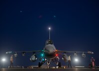 Airmen prepare an aircraft for take-off on the flight line.