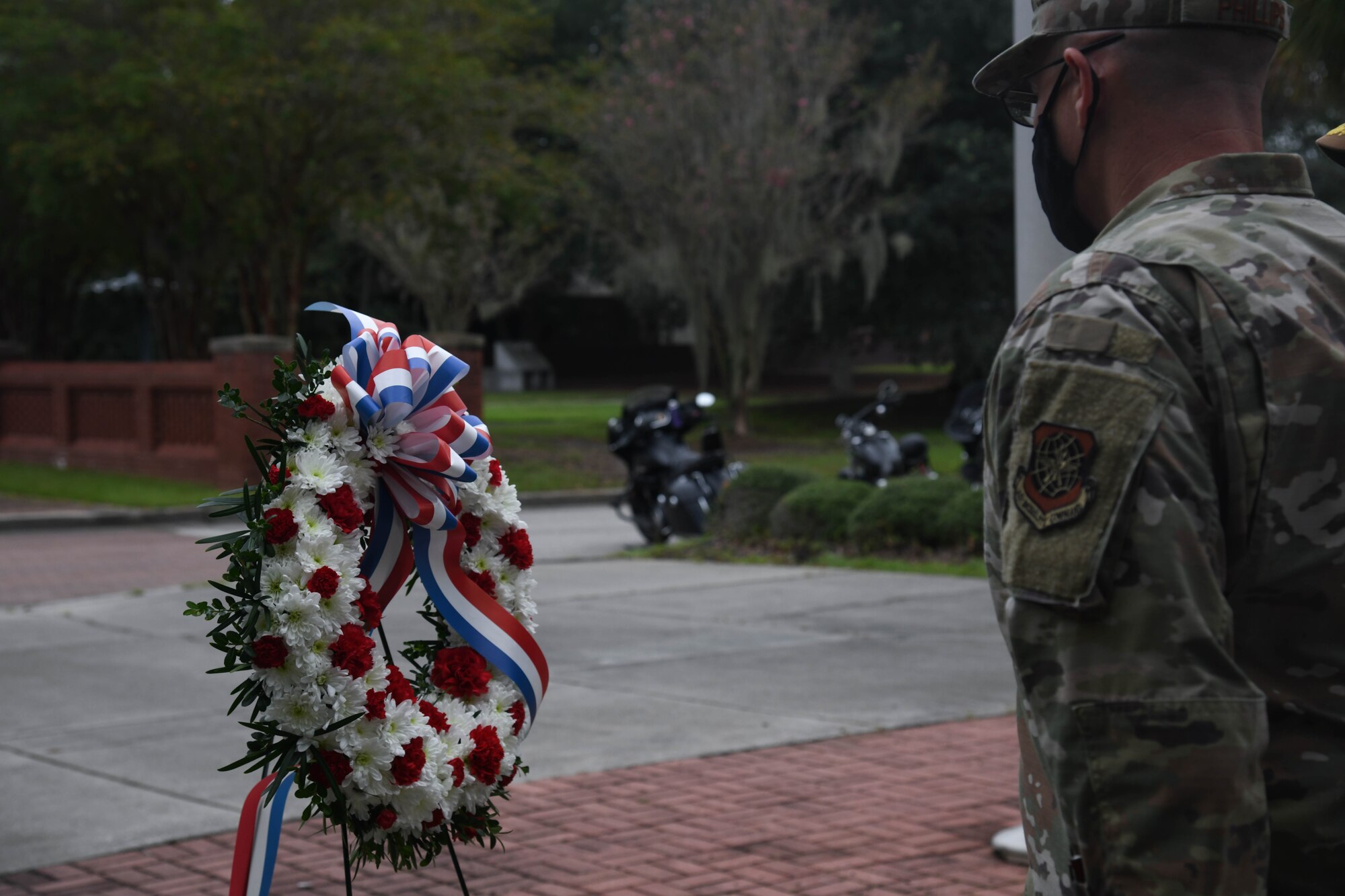 Chief Master Sgt. Ronnie Phillips, former 437th Airlift Wing command chief, and Navy Capt. Kevin Byrne, 628th Air Base Wing Deputy Joint Base commander, lay a wreath during a retreat ceremony Sept. 18, 2020, at Joint Base Charleston, S.C.