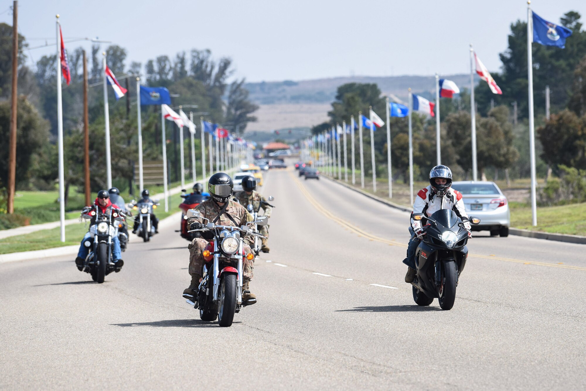 A motorcade makes their way to the Prisoner of War and Missing in Action Remembrance Ceremony Sept. 17, 2020, at Vandenberg Air Force Base, Calif. After the motorcade, Vandenberg AFB leadership gave speeches and a ceremonial presentation of the POW/ MIA flag. . Following the ceremony, members across the installation participated in a 24-hour walk or ruck while carrying the POW/ MIA flag, as well as a continuous 24-hour name reading of the past and current POW/MIA members, until the closing ceremony the next day. (U.S. Air Force photo by Senior Airman Hanah Abercrombie)