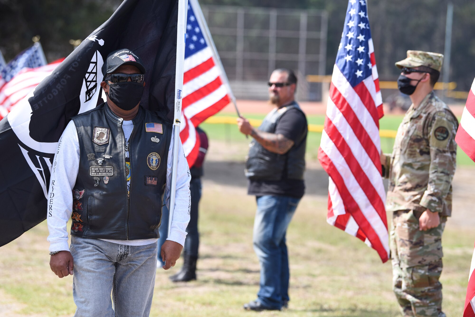 Members participate in a ceremonial presentation of the Prisoner of War and Missing in Action flag during the POW/MIA Remembrance Ceremony Sept. 17, 2020, at Vandenberg Air Force Base, Calif. The first POW/MIA ceremony was held at the National Cathedral in Washington, D.C., after becoming an official recognition day in 1979. According to the Defense POW/MIA Accounting Agency, roughly 83,114 Americans from over five wars went missing in action, and 16,837 Americans died as prisoners of war. (U.S. Air Force photo by Senior Airman Hanah Abercrombie)