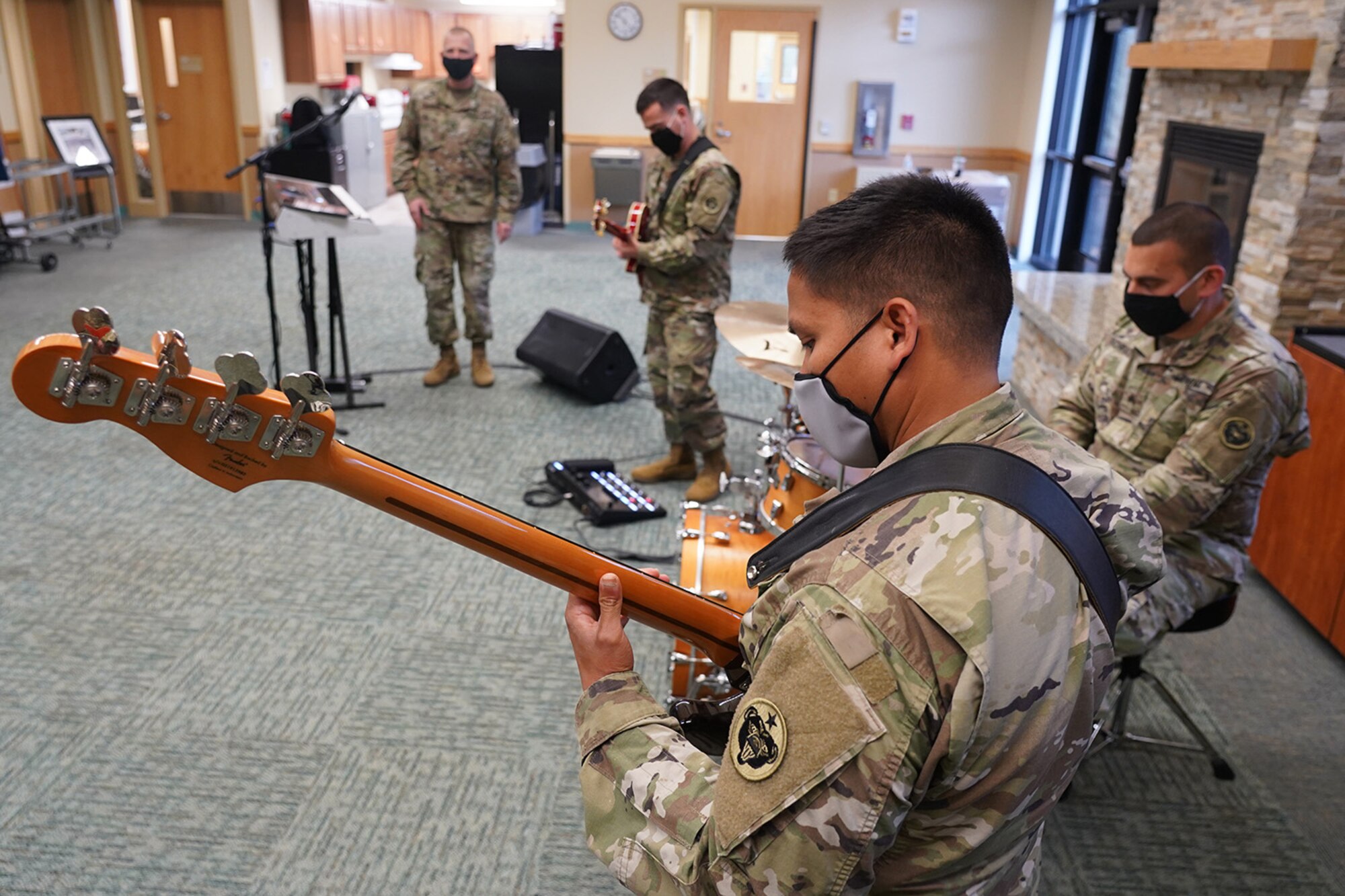 Army Sgt. Johndavid Untalan, a native of Dededo, Guam, and a bassist assigned to the 9th Army Band, 17th Combat Sustainment Support Battalion, U.S. Army Alaska, rehearses with fellow Soldiers in an open room at their unit headquarters on Joint Base Elmendorf-Richardson, Alaska, Sept. 17, 2020.