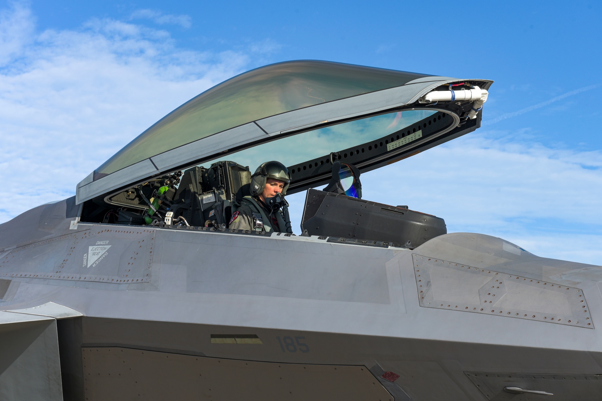 U.S. Air Force Capt. Nichole Ayers with the 27th Fighter Squadron assigned to Joint Base Langley-Eustis, Virginia, finishes pre-flight checks before taking to the air in an F-22 Raptor at Tyndall Air Force Base, Florida, Sept. 18, 2020. Ayers and many others from Air Combat Command travelled to Tyndall for a Weapons System Evaluation Program to practice and troubleshoot air-to-air and air-to-ground weapons system functions. (U.S. Air Force photo by Staff Sgt. Magen M. Reeves)