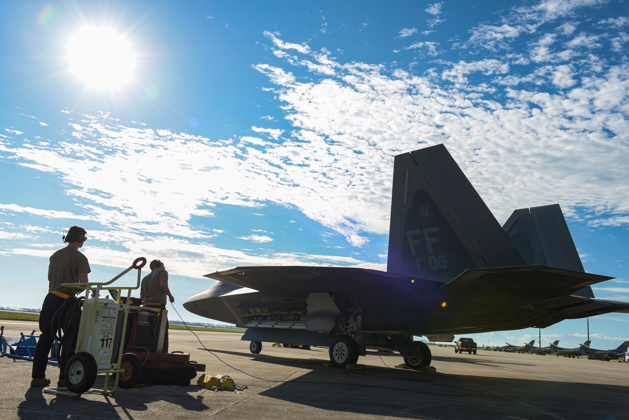 U.S. Air Force Airman 1st Class Keith Walton, avionics systems specialist, left, and Senior Airman Cody Gregory, assistant crew chief, right, with the 27th Fighter Squadron assigned to Joint Base Langley-Eustis, Virginia, preform pre-flight checks with pilot Capt. Nichole Ayers, also from the 27th FS at Tyndall Air Force Base, Florida, Sept, 18, 2020. Approximately 45 F-22 Raptor and F-15 Eagle aircraft and aircrew teams from Air Combat Command traveled to Tyndall for a Weapons System Evaluation Program to practice and troubleshoot air-to-air and air-to-ground weapons system functions. (U.S. Air Force photo by Staff Sgt. Magen M. Reeves)