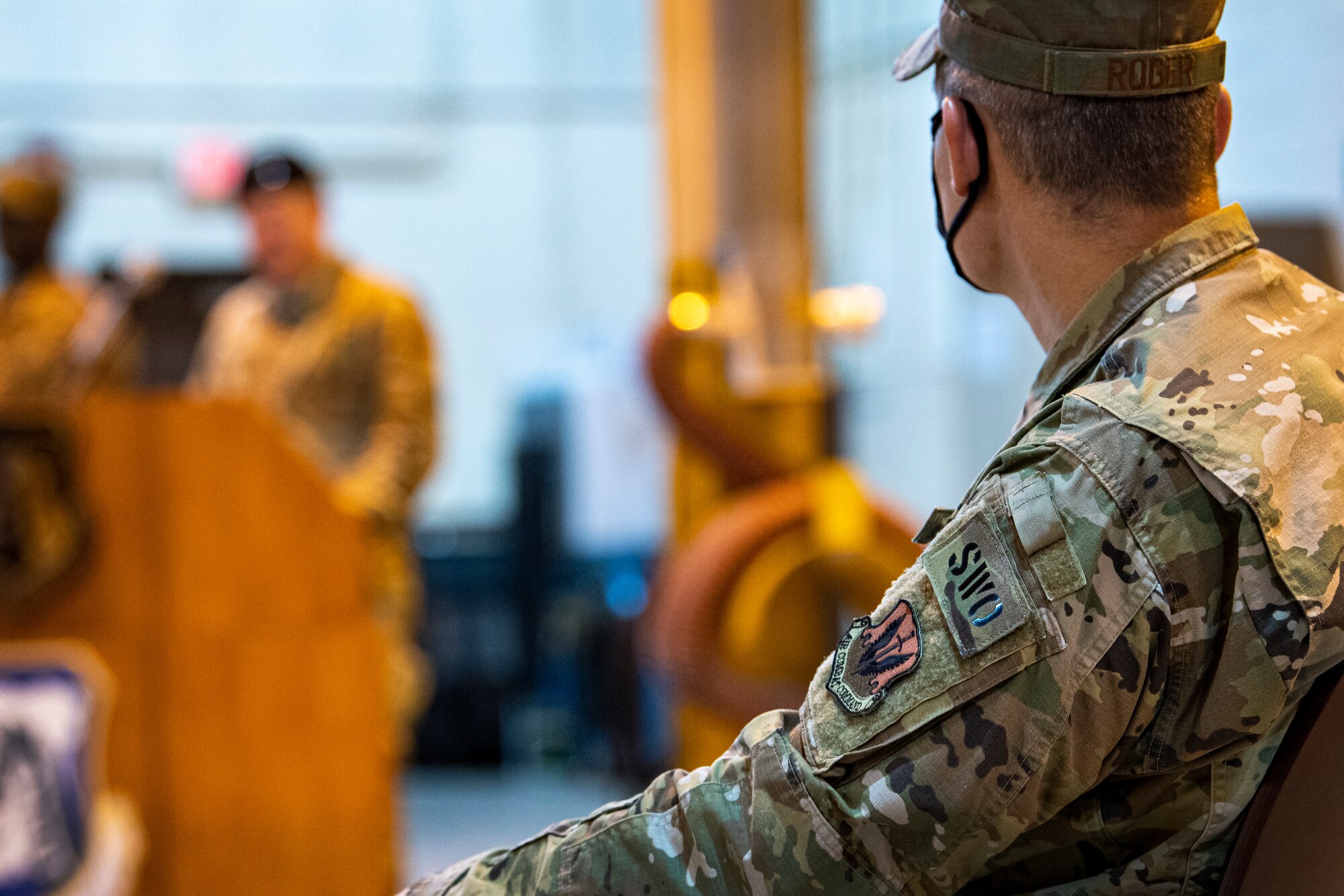Airman listens during ceremony