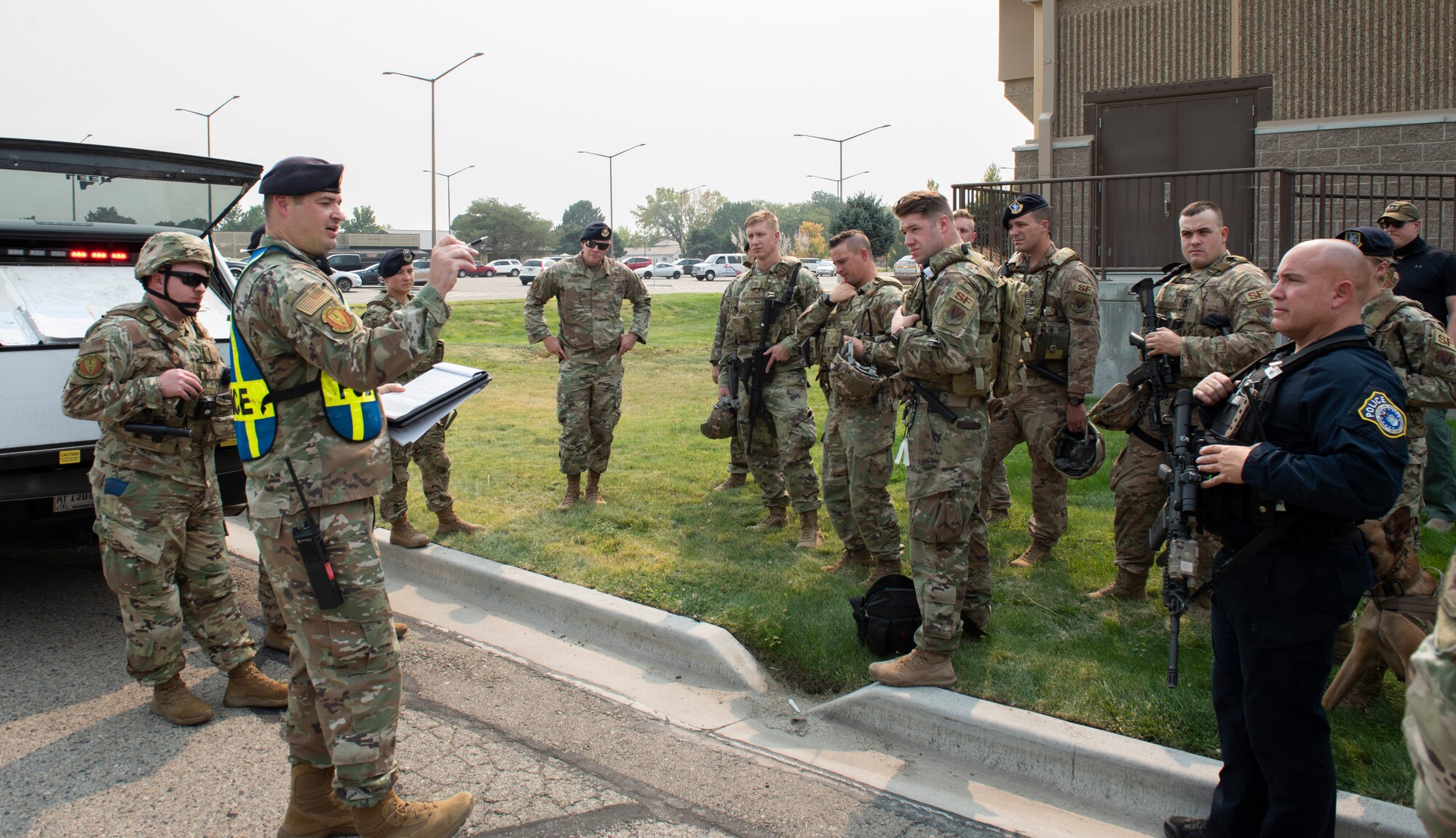 The Airman gets a briefing on how they performed in the active shooter exercise.