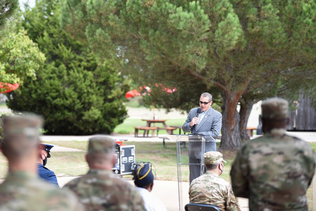 Scott Bailey, 30th Space Wing historian, gives a speech during the Prisoner of War and Missing in Action Closing Ceremony Sept. 18, 2020, at Vandenberg Air Force Base, Calif. The first POW/MIA ceremony was held at the National Cathedral in Washington, D.C., after becoming an official recognition day in 1979. According to the Defense POW/MIA Accounting Agency, roughly 83,114 Americans from over five wars are missing in action, and 16,837 Americans died as prisoners of war. (U.S. Air Force photo by Senior Airman Hanah Abercrombie)