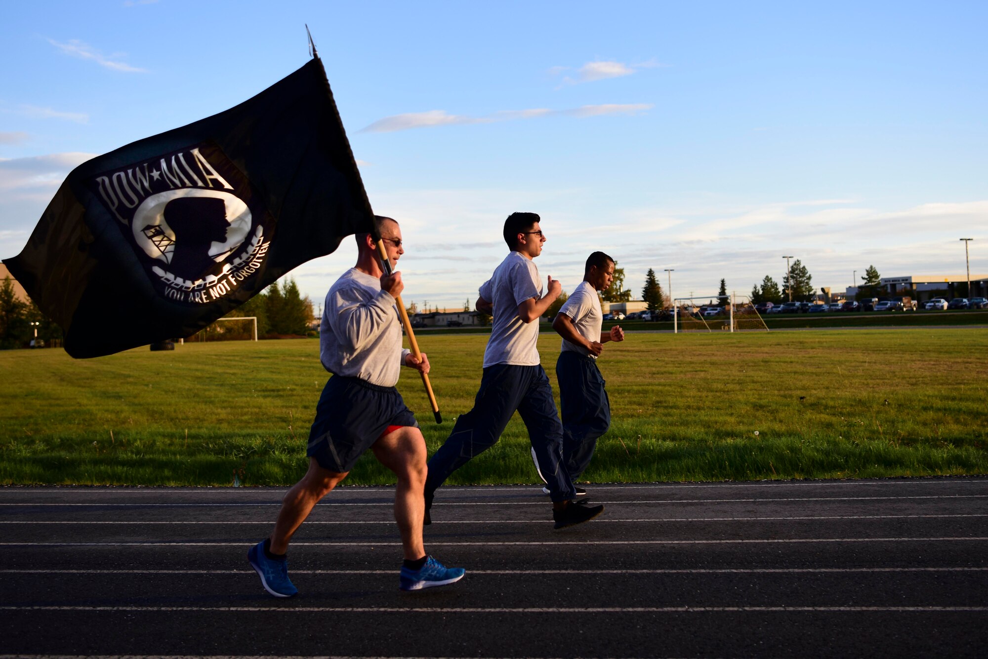 U.S. Air Force Airmen assigned to the 354th Force Support Squadron participate in a POW/MIA 24-hour Remembrance run at the outdoor track on Eielson Air Force Base, Alaska, Sept. 18, 2020.