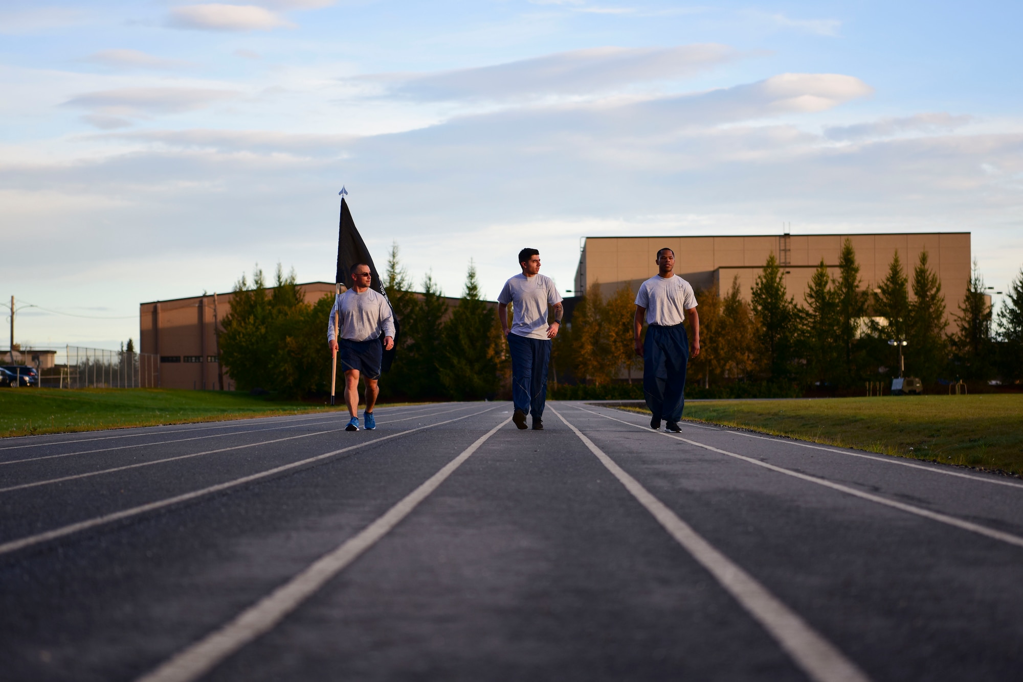 U.S. Air Force Airmen assigned to the 354th Force Support Squadron walk on the track during the POW/MIA 24-hour run on Eielson Air Force Base, Alaska, Sept. 18, 2020.