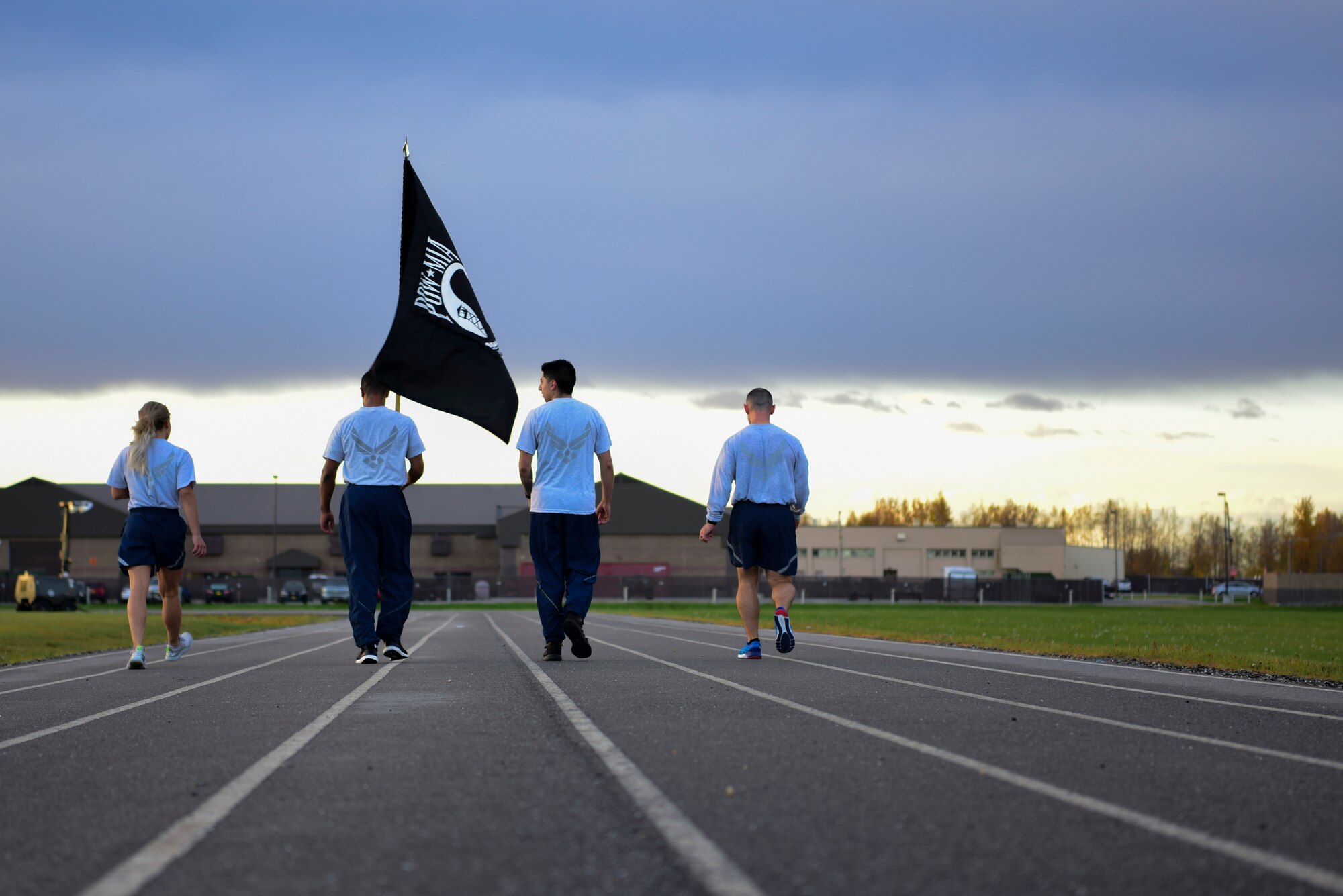 U.S. Air Force Airmen assigned to the 354th Force Support Squadron walk their last lap on the track during the POW/MIA 24-hour run at Eielson Air Force Base, Alaska, Sept. 18, 2020.