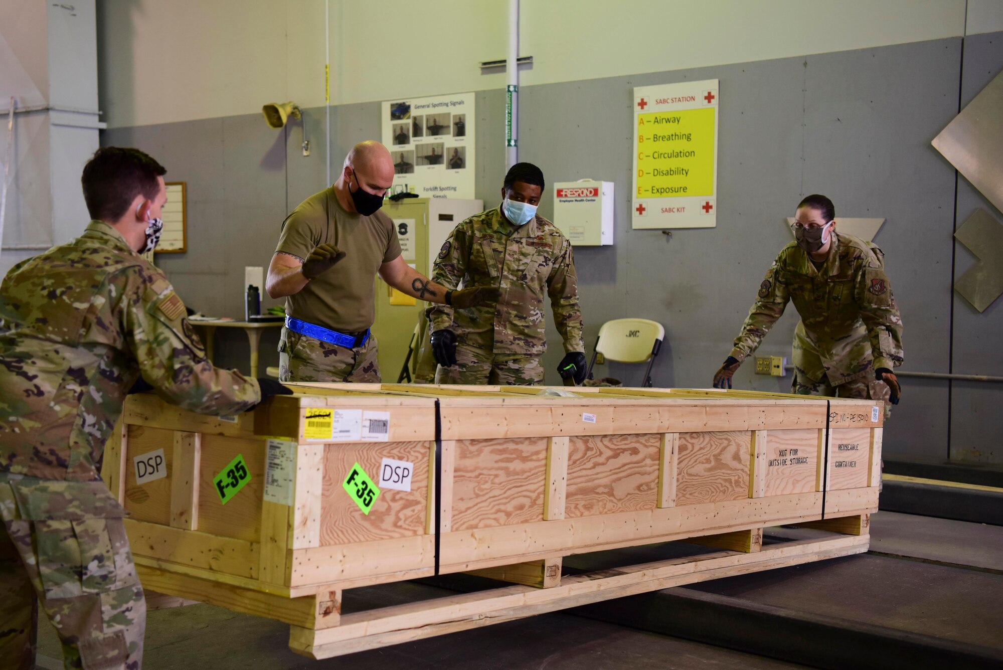 U.S. Air Force Airmen assigned to the 354th Logistics Readiness Squadron search for the center of the crate during Arctic Fox 20-2 on Eielson Air Force Base, Alaska, Sept. 15, 2020. The objective of this step is to find the item’s center to avoid throwing off the balance of a cargo plane that it is going to be loaded on. (U.S. Air Force photo by Airman 1st Class Jose Miguel T. Tamondong)