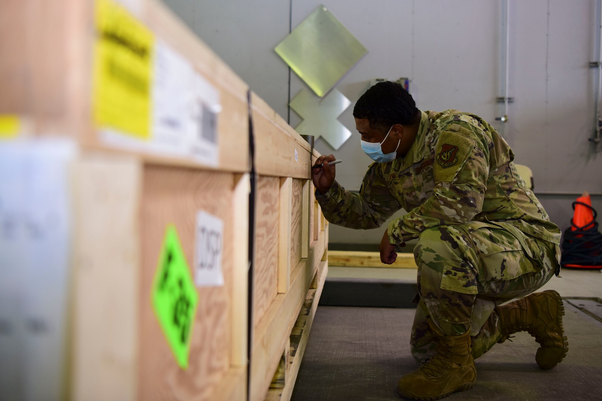 U.S. Air Force Staff Sgt. Rodney Vinson, a 354th Logistics Readiness Squadron fleet management and analysis journeyman, labels a crate during Arctic Fox 20-2 on Eielson Air Force Base, Alaska, Sept. 15, 2020. Finding the item’s center of balance helps out loadmasters in their load planning for an aircraft. (U.S. Air Force photo by Airman 1st Class Jose Miguel T. Tamondong)