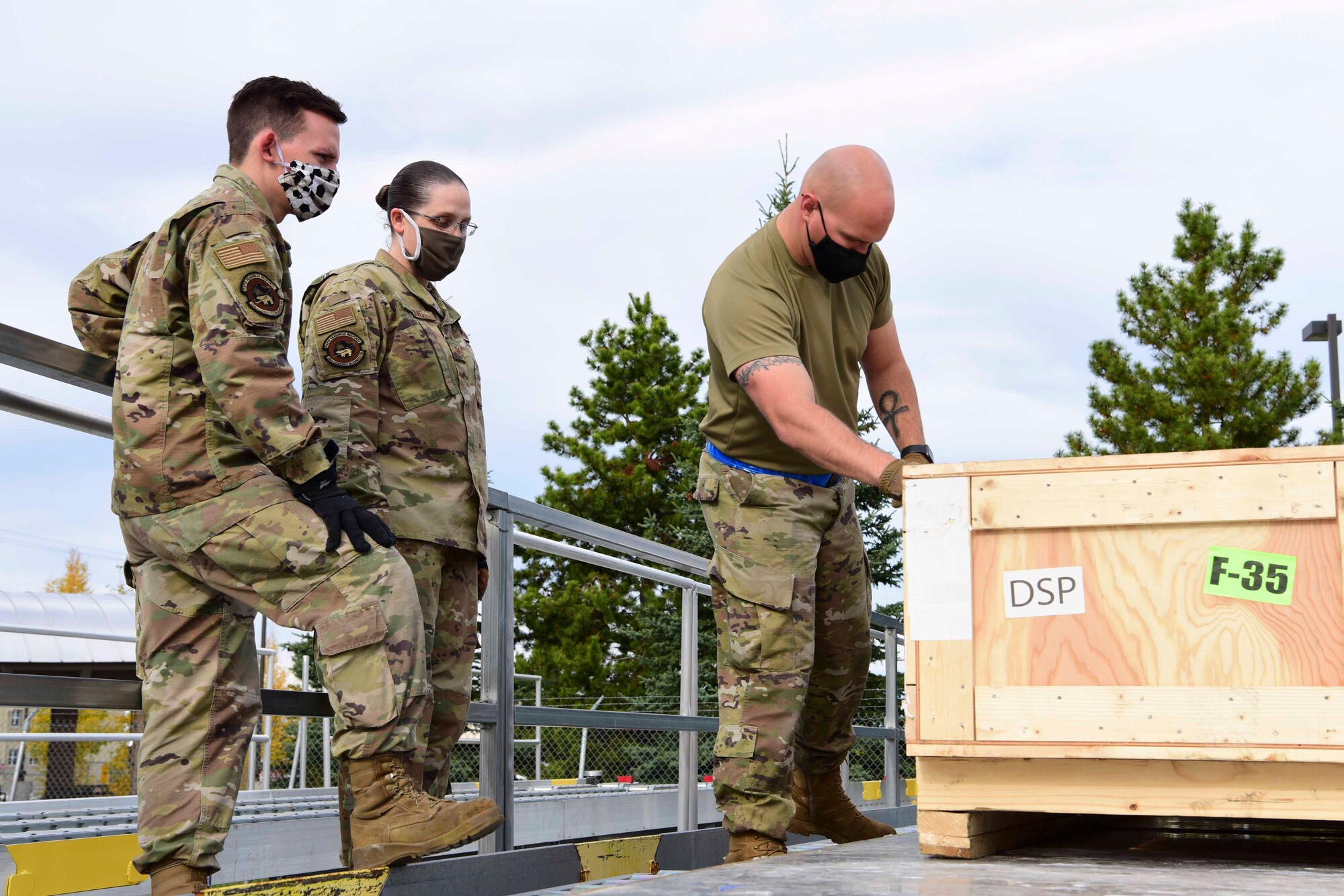 U.S. Air Force Airmen assigned to the 354th Logistics Readiness Squadron (LRS) prepare to restrain a crate during Arctic Fox 20-2 on Eielson Air Force Base, Alaska, Sept. 15, 2020. The 354th LRS is responsible for passing assets to deploying. (U.S. Air Force photo by Airman 1st Class Jose Miguel T. Tamondong)