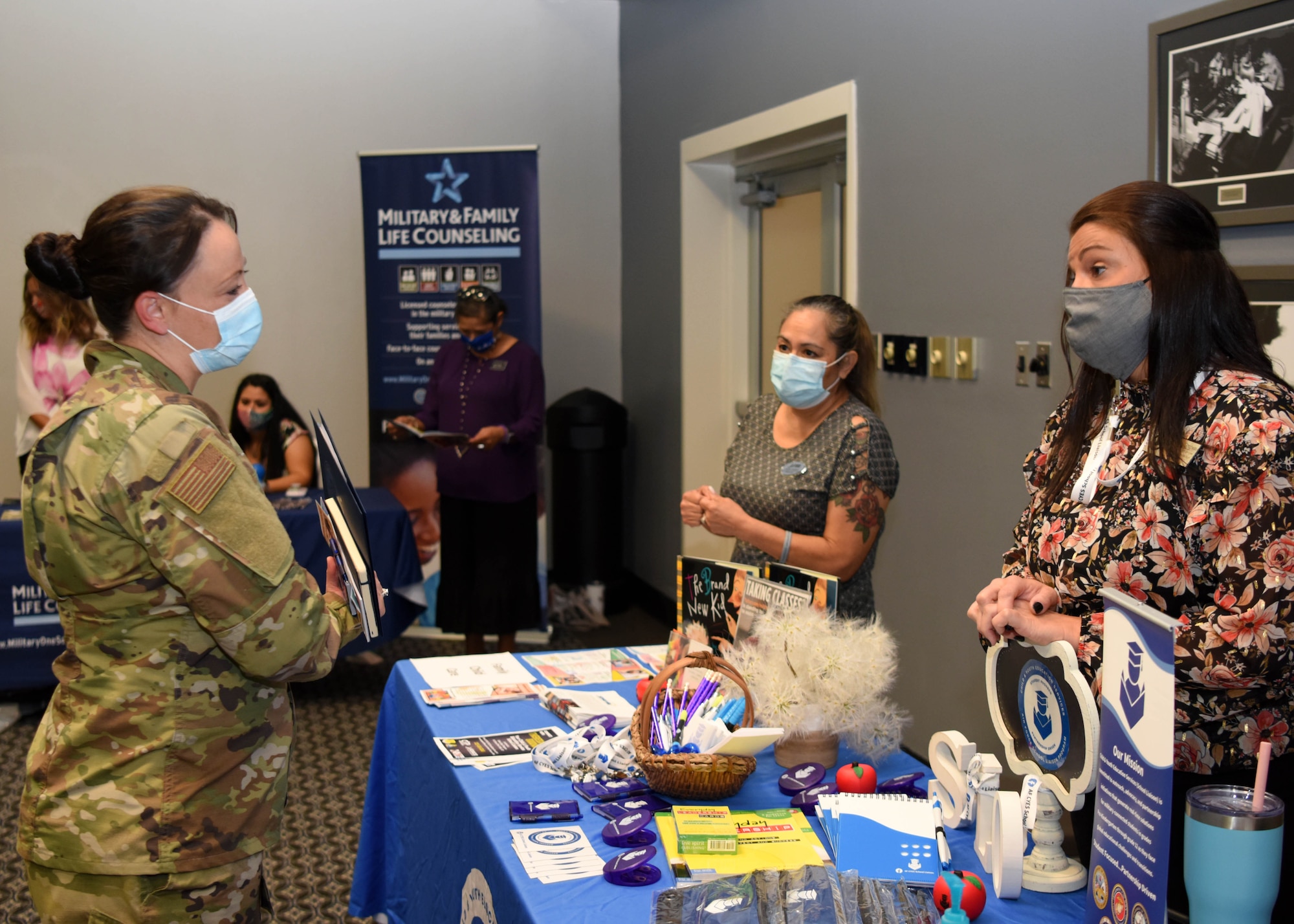 School Liaison Officer Theresa Goodwin speaks to a military parent about her struggles moving from Illinois to Texas at the Newcomer’s Information Fair at the event center on Goodfellow Air Force Base, Texas, Sept. 16, 2020. Goodwin is the Goodfellow SLO and oversees 453 campuses and 43 independent school districts. (U.S. Air Force photo by Airman 1st Class Ethan Sherwood)