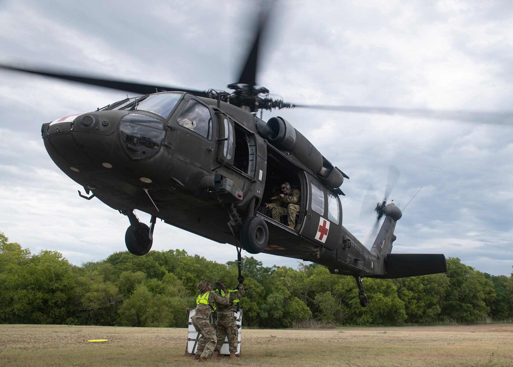 Airmen assigned to the 74th Aerial Port Squadron rig equipment to a UH-60 Black Hawk helicopter during a rigging practice mission Sept. 9 at Joint Base San Antonio-Medina.