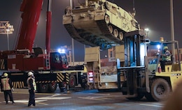 Contractors move a tank into position to be loaded at the Port of Shuiaba, Kuwait, September 11, 2020. The 1184th Deployment and Distribution Support Battalion, from Mobile, AL plays a vital role by relocating equipment because units rely on the equipment to carry out their missions. (U.S. Army Reserve Photo By Sgt. Vontrae Hampton)