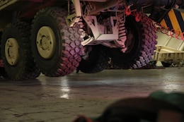 Soldiers lower this vehicle to the ground at the Port of Shuiaba, Kuwait, September 11, 2020. The 1184th Deployment and Distribution Support Battalion, from Mobile, AL plays a vital role by relocating equipment because units rely on the equipment to carry out their missions. (U.S. Army Reserve Photo By Sgt. Vontrae Hampton)