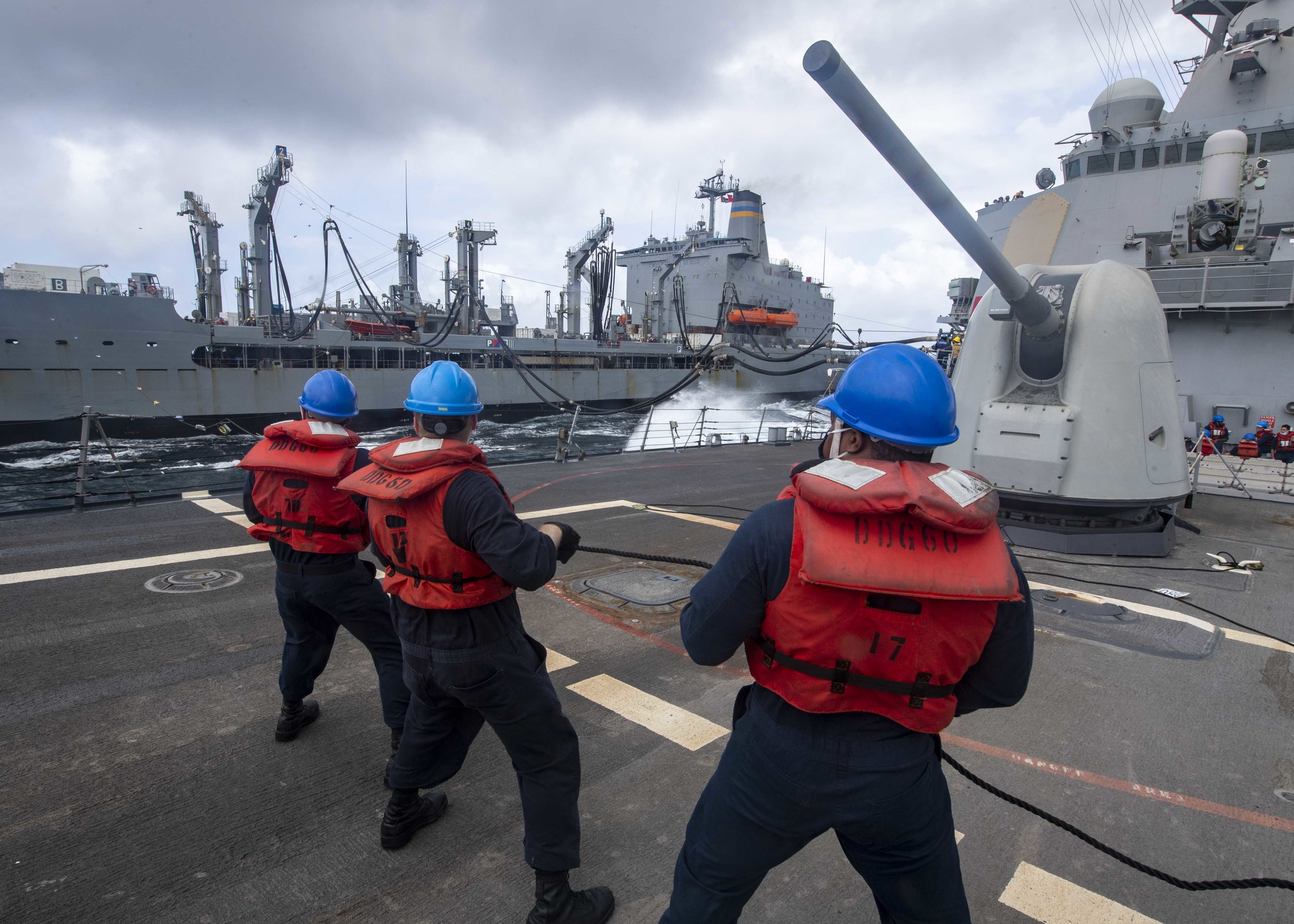 Sailors maintain tension on the phone and distance line aboard the guided-missile destroyer USS Paul Hamilton (DDG 60) during a replenishment-at-sea with the Military Sealift Command fleet replenishment oiler USNS Yukon (T-AO 202) in the Arabian Sea.