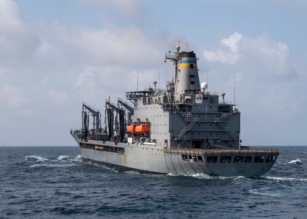 The Military Sealift Command fleet replenishment oiler USNS Yukon (T-AO 202) prepares to conduct a replenishment-at-sea with the guided-missile destroyer USS Paul Hamilton (DDG 60) in the Arabian Sea.