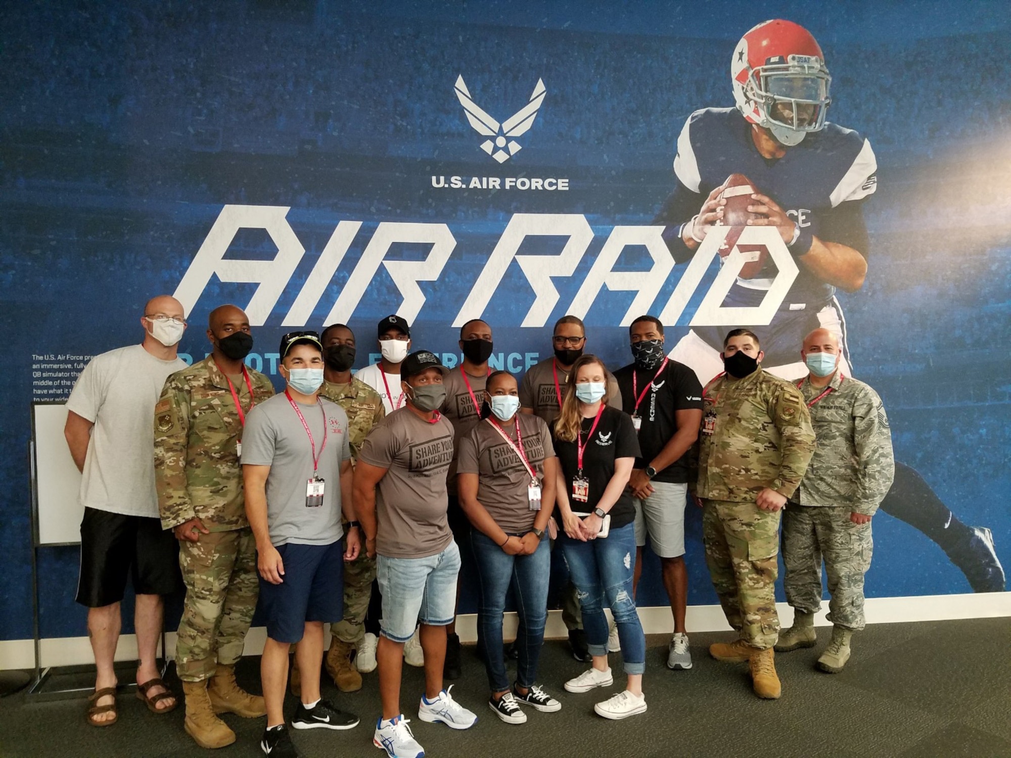 Total Force recruiters pose for a photo at the Chick-Fil-A College Football Hall of Fame, Aug. 28, 2020, in Atlanta Georgia. Air Force Recruiting Service recently signed a partnership with the HOF and the Air Force has a major exhibit called the Air Force Air Raid Quarterback Sim Experience.