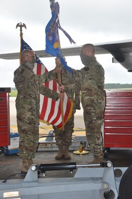 commander hands guidon to new subordinate commander