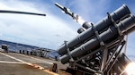 PACIFIC OCEAN (Sept. 19, 2020) -- Ticonderoga-class guided-missile cruiser USS Antietam (CG 54) launches a Harpoon surface-to-surface missile as part of a joint force sinking exercise (SINKEX) targeting the decommissioned frigate USS Curts (FFG 38) during Valiant Shield 2020. Valiant Shield is a U.S. only, biennial field training exercise (FTX) with a focus on integration of joint training in a blue-water environment among U.S. forces. This training enables real-world proficiency in sustaining joint forces through detecting, locating, tracking and engaging units at sea, in the air, on land and in cyberspace in response to a range of mission areas. (U.S. Navy photo by Mass Communication Specialist 3rd Class James Hong)