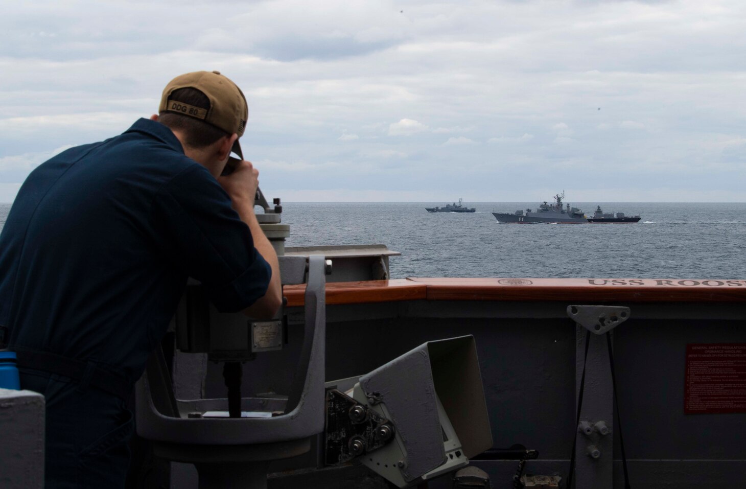 BLACK SEA (Sept. 20, 2020) Quartermaster 2nd Class Daniel A. Draughon takes the bearing of Bulgarian Navy Koni-class frigate BGS Smeli (F-11) and BGS Bodri (F-13) as they participate in a passing exercise with the Arleigh Burke-class guided-missile destroyer USS Roosevelt (DDG 80), Sept. 20, 2020. Roosevelt, forward-deployed to Rota, Spain, is on its first patrol in the U.S. Sixth Fleet area of operations in support of regional allies and partners and U.S. national security interests in Europe and Africa.