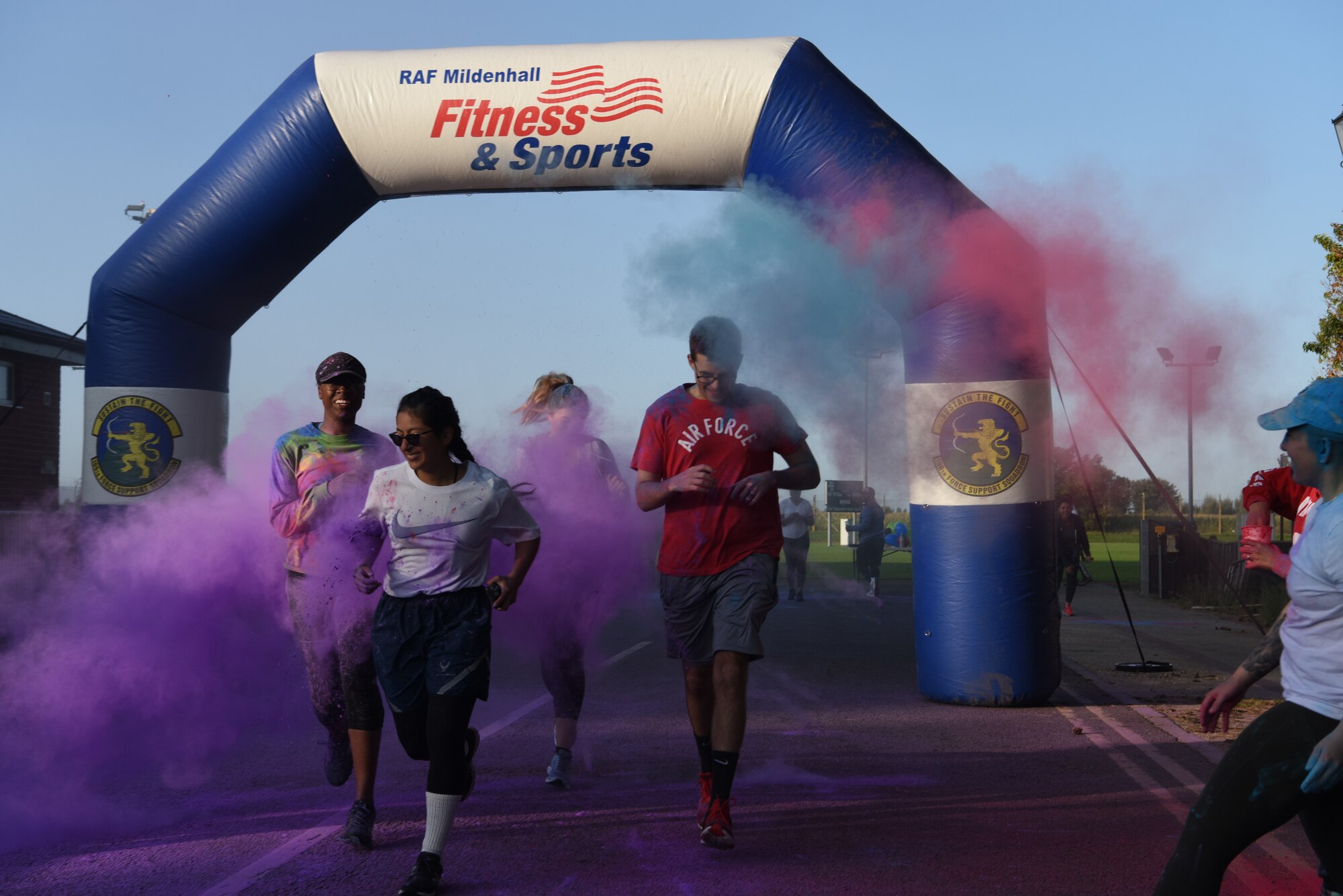 Airmen from Team Mildenhall run through dye during the 5K Color Run for Equality at Royal Air Force Mildenhall, England, Sept. 18, 2020. The run was held to advocate equality for all people regardless of their background.
