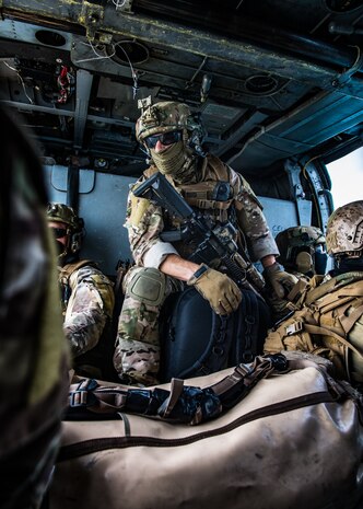 An explosive ordnance disposal technician, assigned to Commander, Task Force (CTF) 56, sits in a MH-60S Sea Hawk helicopter, attached to Helicopter Sea Combat Squadron (HSC) 26, after hoist training operations in the Arabian Gulf Sept. 3. CTF 56 and HSC-26 are deployed to the U.S. 5th Fleet area of operations and conduct mine warfare operations in support of naval operations to ensure maritime stability and security in the Central Region, connecting the Mediterranean and Pacific through the Western Indian Ocean and three strategic chokepoints to the free flow of global commerce.