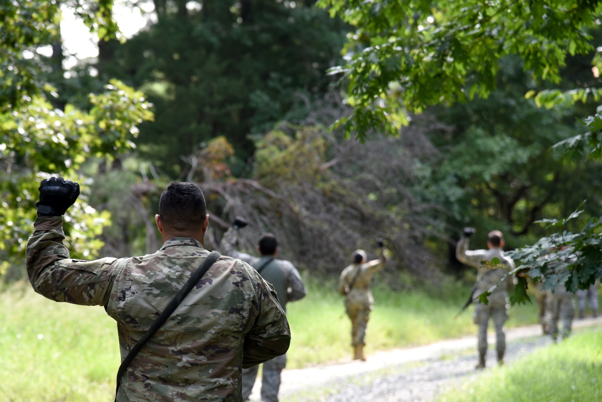 Photo of Airmen performing fire team drills during Fieldcraft Contingency Response training.