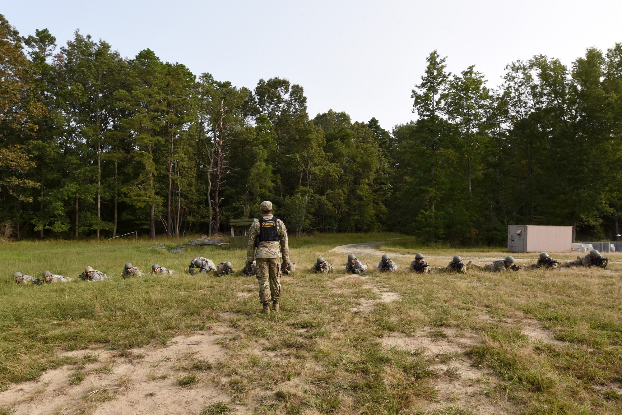 Photo of Airmen performing tactical movement drills during Fieldcraft Contingency Response training.