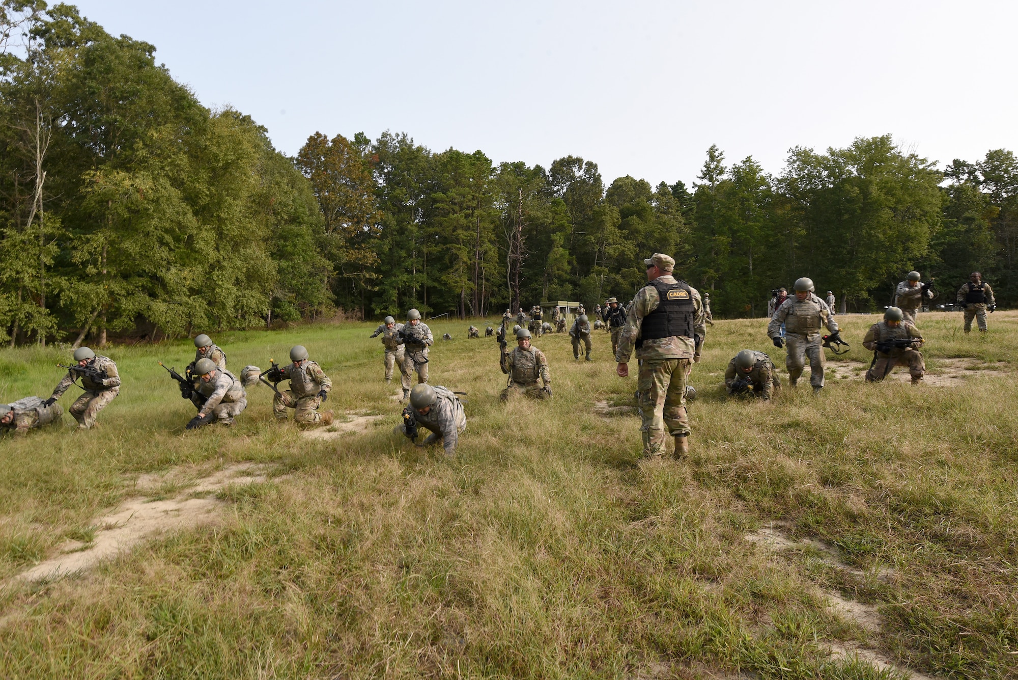Photo of Airmen performing tactical movement drills during Fieldcraft Contingency Response training.