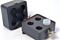 The Mixed Odor Delivery Device contains four compartments in the base (right), each with an odor regulating lid, that releases odors to mix into the top (left) to be expelled and tested with canine units.