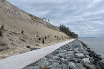 Located on the shore of Maryland’s Chesapeake Bay, the U.S. Naval Research Laboratory’s Chesapeake Bay Detachment is host to experiments ranging from laser and radar testing, to simulated ship-board fire safety and survivability research. In spring 2018, CBD completed an extensive cliff stabilization project along its nearly one-mile of shoreline. Stabilization of the nearly 100 foot vertical cliff included regrading top-side and sloped surfaces to prevent water run-off and the installation of specially designed mats enhanced with shrubs and wildflowers to resist future erosion. (U.S. Naval Research Laboratory)