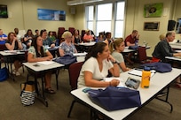 Educators from around the country, attending the Smithsonian Science Education Academy for Teachers in Washington, D.C., listen attentively as Dr. Yates lectures on the science behind microbial fuel cell technology. The weeklong course, dedicated to the teaching and learning of science, provides teachers with a hands-on approach to increase student achievement in STEM curriculums.