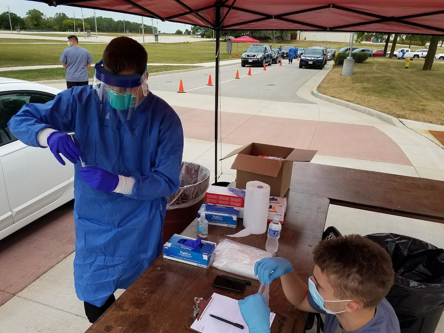 Citizen-Soldiers and Citizen-Airmen from the Wisconsin National Guard collect specimens for COVID-19 testing Sept. 1, 2020, at the Waukesha County Expo Center in Waukesha, Wis. The Wisconsin National Guard has multiple COVID-19 specimen collection teams operating throughout the state.