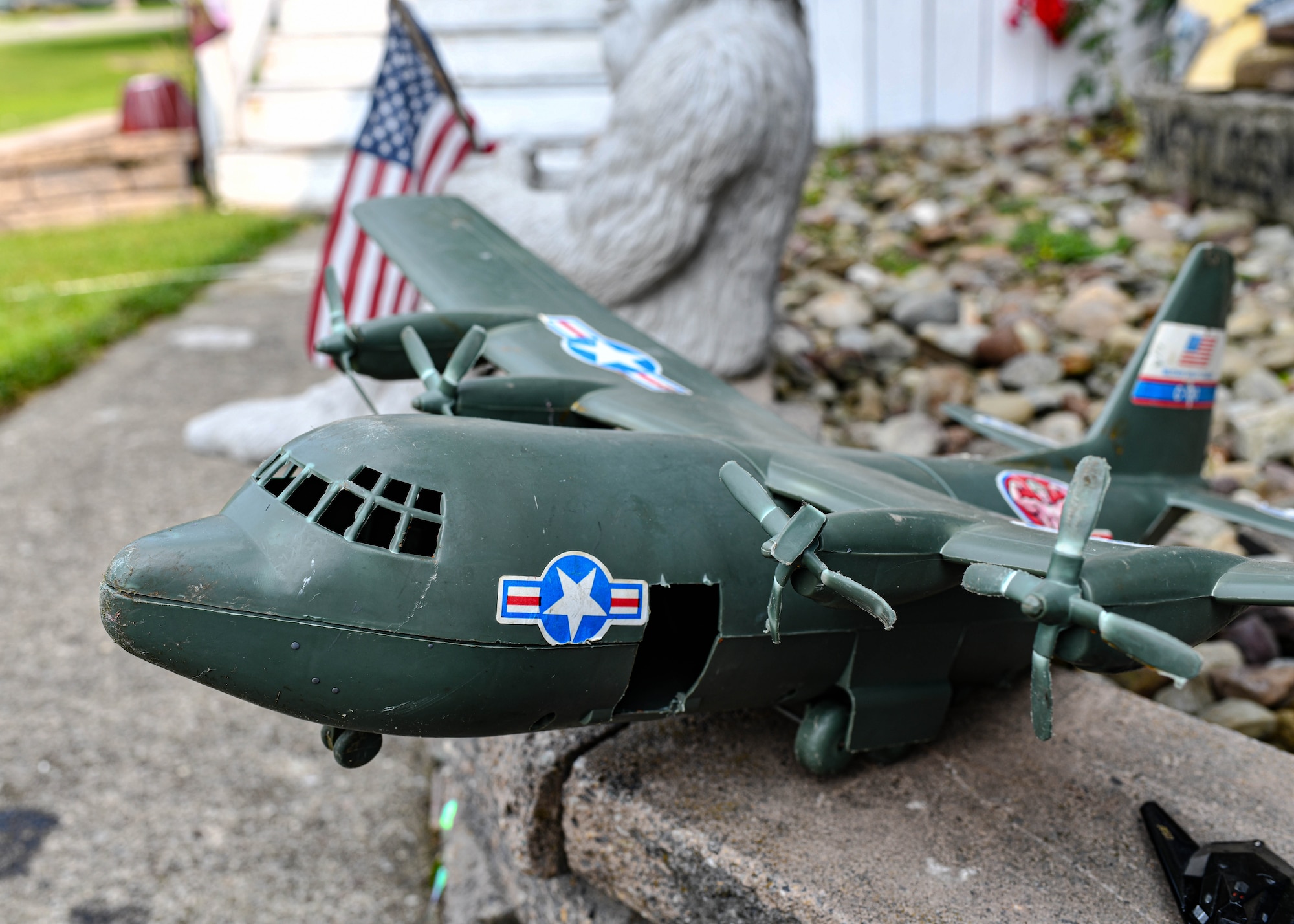 910th Operations Group Commander Lt. Col. Jeff Shaffer delivered Air Force Reserve swag to the McCloskey family in recognition of their son's love for C-130 aircraft and support of the unit.