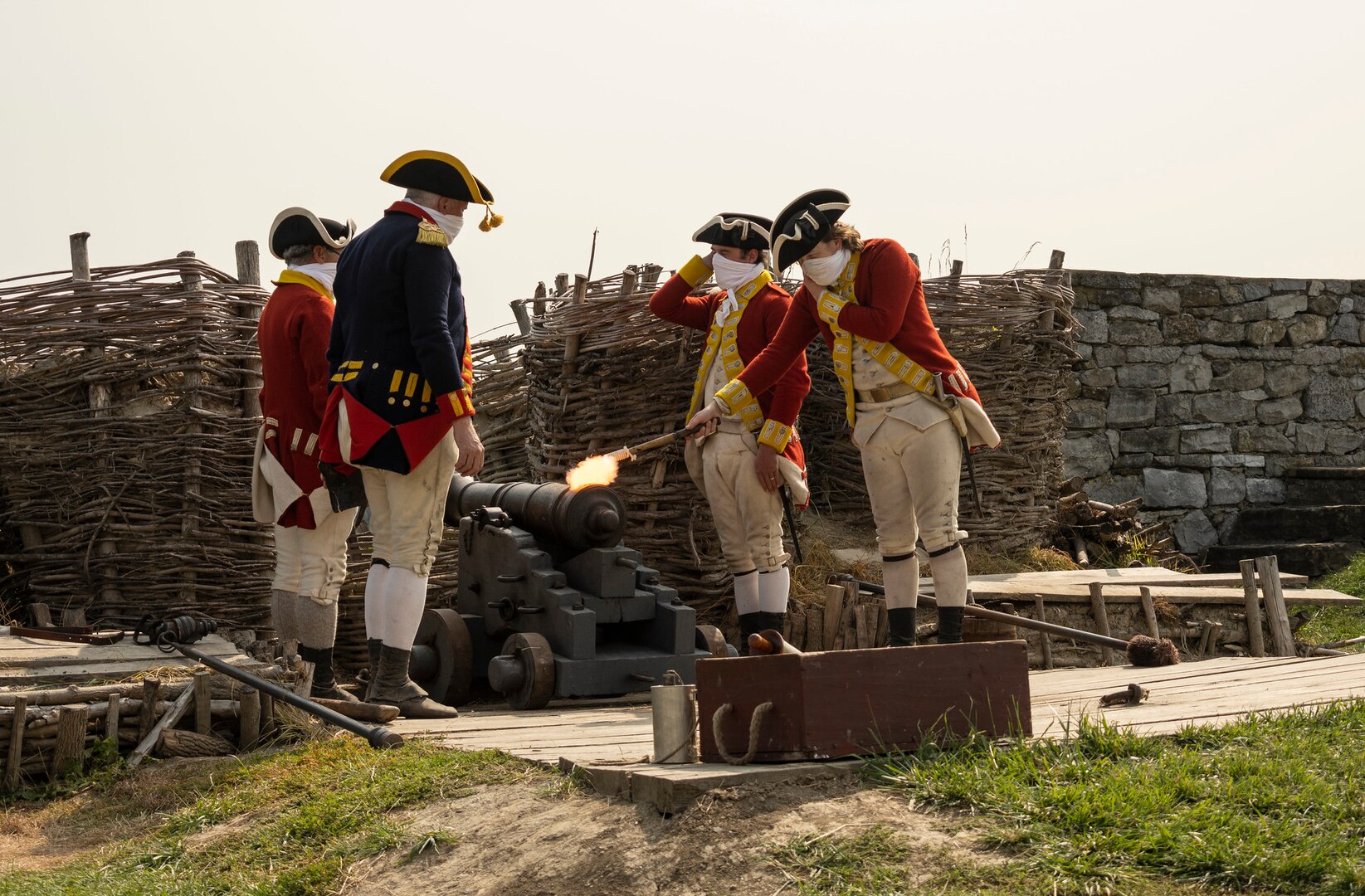 Re-enactors wearing 18th century uniforms demonstrate the firing of a cannon at Fort Ticonderoga in New York Sept. 16, 2020, for members of the New York Army National Guard. The visit was part of the Company Commander and First Sergeant Pre-Command Course of instruction Sept. 14-18. Three dozen Soldiers toured the historic battlefield of the American Revolution and French and Indian War to discover leadership lessons to prepare for their upcoming command tours.