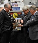 Under Secretary of Defense for Acquisition, Technology and Logistics, USD(AT&L), Frank Kendall, receives a first-hand tour of the NRL laboratories to include an in-depth look at the Navy’s latest research in new weapons technologies, such as the electromagnetic railgun. Kendall received a demonstration of the railgun and state-of-the-art projectiles by Director of Research, Dr. John Montgomery (right) and Superintendent of the Plasma Physics Division, Dr. Thomas A. Mehlhorn (center).
