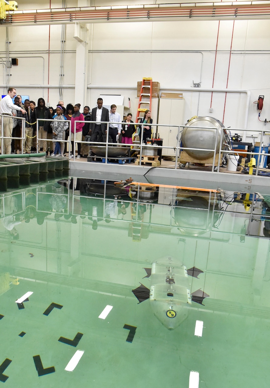 The Laboratory for Autonomous Systems Research (LASR) at the U.S. Naval Research Laboratory (NRL), Washington, D.C., houses some of the most unique research facilities found in the nation used to research the effects of real-world environments on NRL-developed materials and robotic and autonomous systems. In the littoral high-bay, students taking part in the White House National Lab Day initiative were shown how scientists are able to test autonomous underwater vehicles in-lab without the need or expense to travel to field testing sites. The littoral high-bay pool is 25 feet by 45 feet, is 5.5 feet deep, and has a wave generator providing directional waves. The pool may be equipped with sand, mud, and stone to emulate various shorelines.