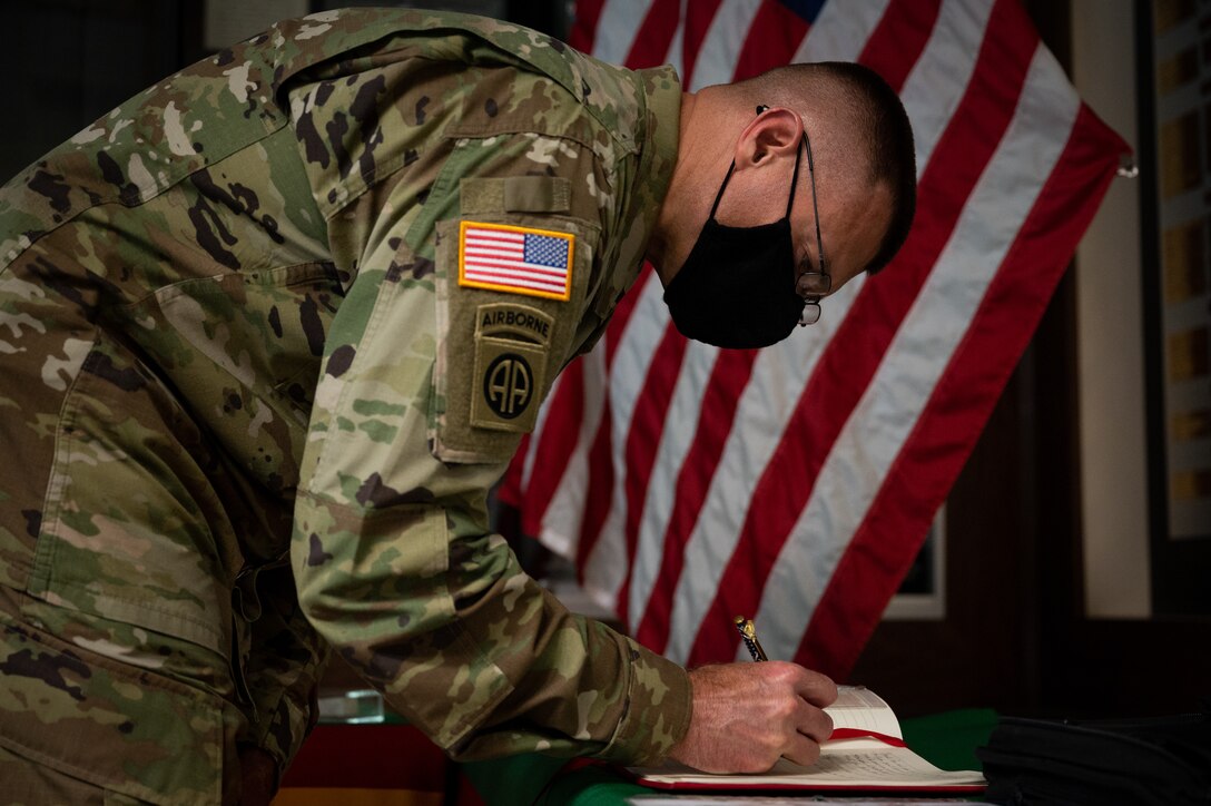 Col Thigpen signing Ground Zero Flag Team ledger