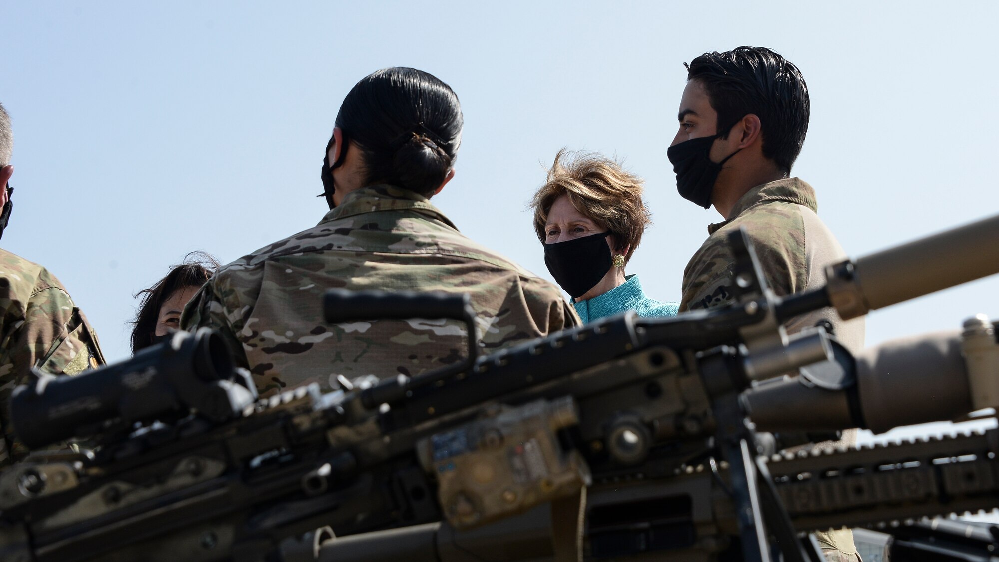 A photo of SecAF listening to Airmen brief her on the wing's rescue capabilities