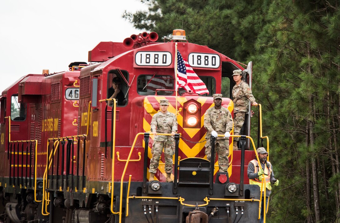 Soldiers posing for photo on railcar during 9/11 remembrance ceremony