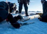 U.S. Naval Research Laboratory (NRL) scientists, Dr. Andrei Abelev and Dr. Joan Gardner, examine an extracted ice core during the Navy’s March 2016 ICe Exercise (ICEX) above the Arctic Circle. The core samples will help the scientists measure salinity, density, and crystal structure, as part on an ongoing ice characterization research project. ICEX 2016 is a five-week exercise designed to research, test, and evaluate operational capabilities in the region, providing the Navy the tools to assess operational readiness in the Arctic, increase experience in the region, advance understanding of the Arctic environment, and develop partnerships and collaborative efforts.