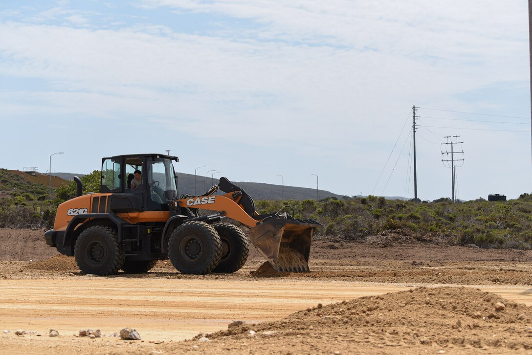 Airman 1st Class Brian Farris, 30th Civil Engineer Squadron heavy equipment operator, works on the gaseous nitrogen pad Aug. 18, 2020, at Vandenberg Air Force Base, Calif. The construction of the pad took 20 days to complete, allowing it to be ready to hold nitrogen production equipment such as pumper trucks and 200,000 lb liquid storage trailers for the NROL-82 mission. (U.S. Air Force photo by Senior Airman Hanah Abercrombie)