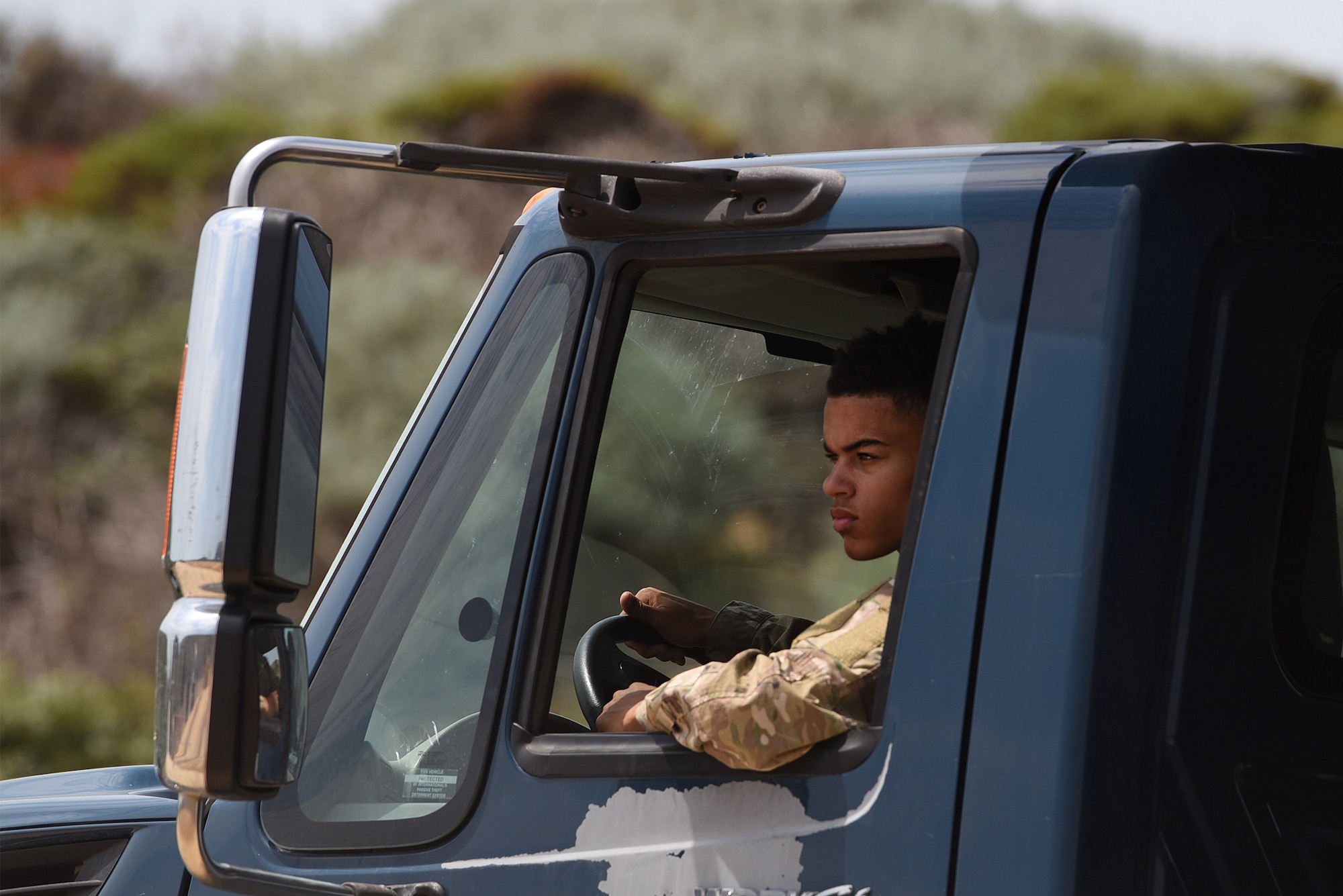 Airman 1st Class Cortez Terrell, 30th Civil Engineer Squadron heavy equipment operator, drives a truck delivering dirt for the gaseous nitrogen pad Aug. 18, 2020, at Vandenberg Air Force Base, Calif. The pad will be used to bed-down trucks and trailers outfitted with nitrogen production equipment to supply gaseous nitrogen for upcoming ULA Delta Heavy launches. (U.S. Air Force photo by Senior Airman Hanah Abercrombie)