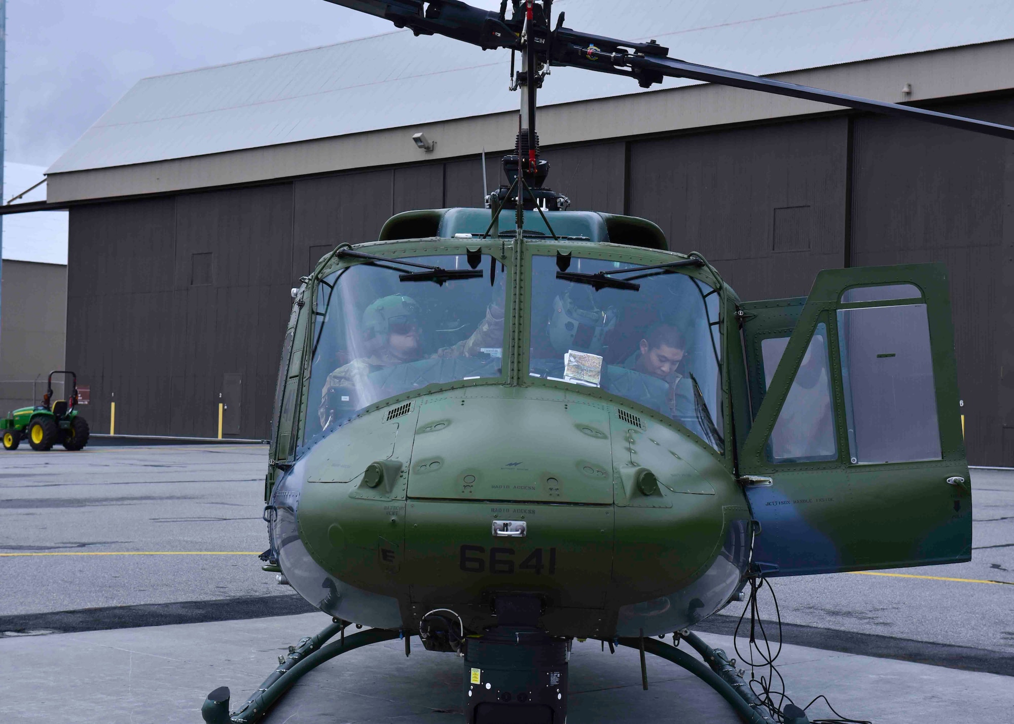 U.S. Air Force Capt. Joel Lewis, 36th Rescue Squadron executive officer, and 1st Lt. Daniel Iwata, 36th RQS chief of scheduling, prepare for takeoff in a Bell UH-1N Iroquois helicopter at Fairchild Air Force Base, Washington, Jan. 30, 2020. The UH-1N is categorized as the utility helicopter in the Air Force due to its versatility. (U.S. Air Force by Airman 1st Class Kiaundra Miller)