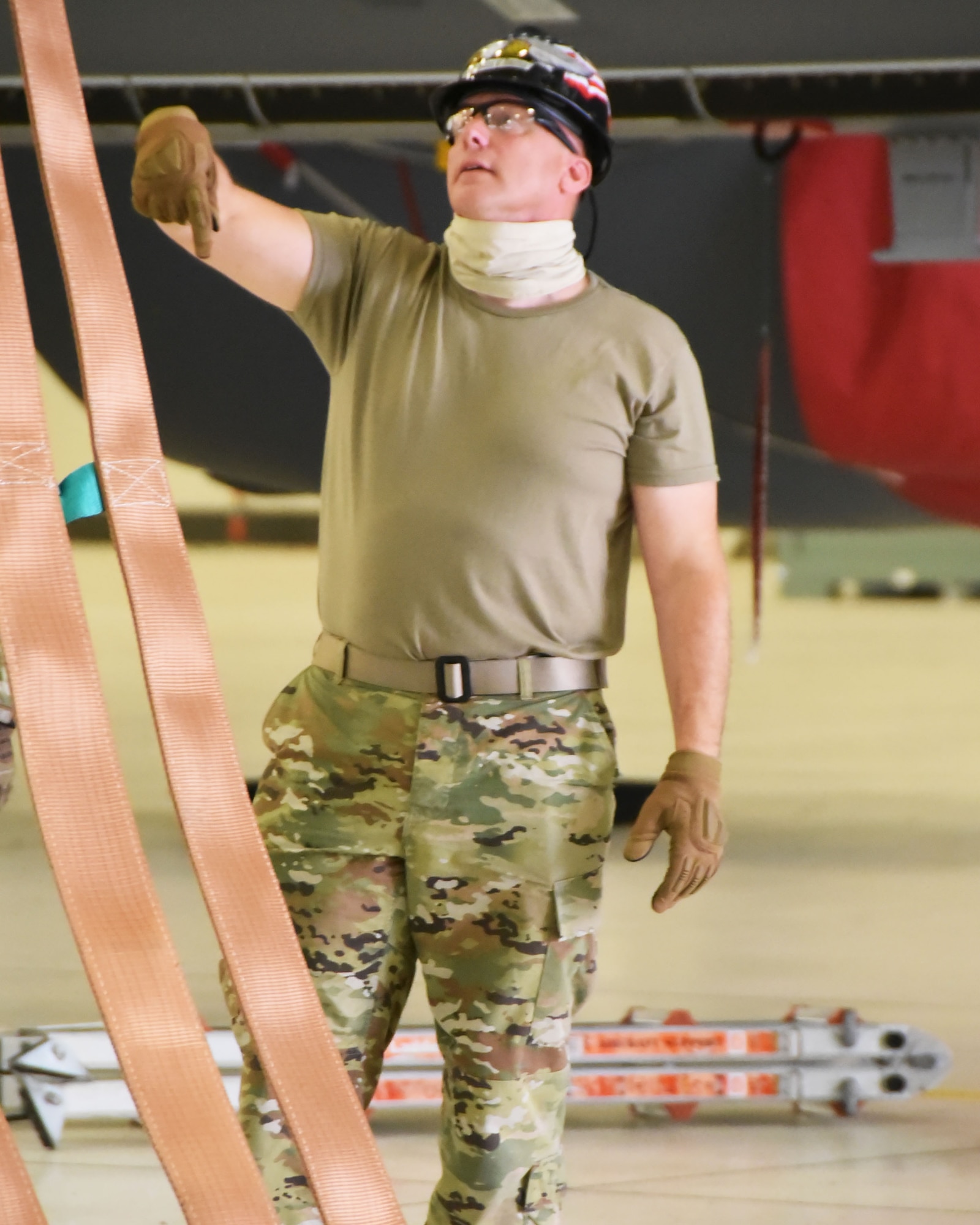 Senior Master Sgt. Gregory Mitchell, 931st Maintenance Squadron Repair and Reclamation Section chief, directs a “cherry picker” crane as part of a KC-46 Pegasus Crashed, Damaged or Disabled Aircraft Recovery exercise Sept. 17, 2020, at McConnell Air Force Base, Kansas.  This was the first time a CDDAR was performed with the KC-46.