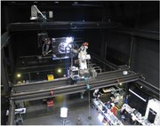 U.S. Naval Research Laboratory (NRL) engineers in the Space Robotics Laboratory (SRL) perform full-scale rendezvous and docking testing with a “mock-up” of a communication satellite launch vehicle interface. These tests are designed to develop and analyze software algorithms and autonomous and on-ground controls in a simulated on-orbit configuration. (Photo: U.S. Naval Research Laboratory – Released)
