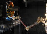 The Front-end Robotics Enabling Near-term Demonstration, or FREND, flight prototype robotic arm performs fully autonomous grapple testing. This testing demonstrates RSGS on-board processing’s ability to track and guide a robotic arm to grapple a launch vehicle adapter ring (left) that is common to many spacecraft designs.